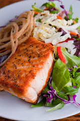 Salmon Steak. Grade A grass fed angus beef steaks. Tenderloin, filet mignon, New York strip, bone in rib-eye grilled medium rare on outdoor wood-fired grill. Classic American steakhouse entree.