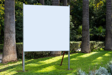 Billboard blank white, green nature background, copy space