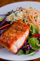 Salmon Steak. Grade A grass fed angus beef steaks. Tenderloin, filet mignon, New York strip, bone in rib-eye grilled medium rare on outdoor wood-fired grill. Classic American steakhouse entree.