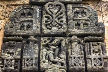 Ancient stone carvings on the walls of a HIndu temple