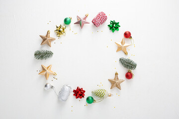 Christmas  decor composition. Wreath of decorations stars, eve, pine cone on white background.  Holiday concept