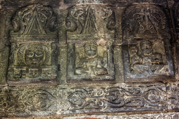 Ancient stone carvings on the walls of a HIndu temple