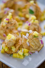 Fried oysters. Fresh oysters fried and served with garlic, shallots, cocktail sauce, mignonette sauce and fresh lemons and limes. Classic American steakhouse or French bistro appetizer.