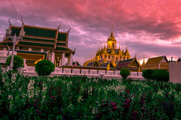 Fototapeta premium Background of tourist attractions where people come to see the beauty of the architecture of the golden pagoda in Bangkok (Wat Metal Prasat Or Wat Ratchanaddaram Worawihan) in Thailand
