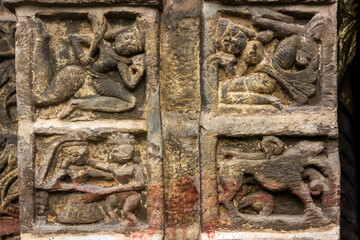Naggar, Himachal Pradesh, India - June 2012:  Ancient carvings on the stone walls of an old Hindu temple in the Kullu valley.