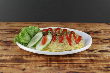 Delicious Pataya Fried Rice with salad and cucumber