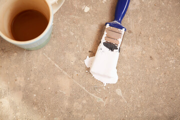 Coffee Mug And Paintbrush On Floor