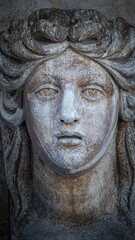 Ancient aged sculpture of beautiful Venetian Renaissance Era woman in Venice, Italy