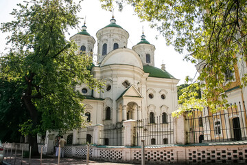 Fototapeta na wymiar Holy Intercession Podil Church in the style of Ukrainian Baroque in historical center of Kyiv, Ukraine. May 2011