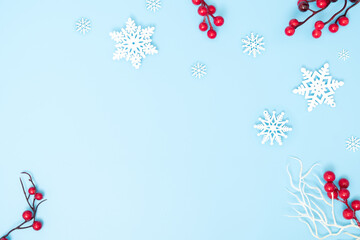 Christmas holiday and happy new year composition and snowflakes decoration on blue background, flat lay, top view and copy space, for banner card