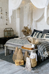 Comfortable bedroom in house with cozy interior