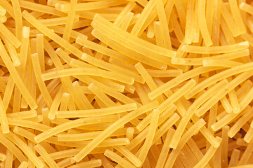 Dry vermicelli pasta backround. Close up view.