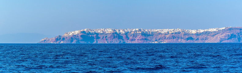 A view across the Caldera waters towards the northern tip of Santorini in summertime