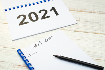 Wishlist for 2021 on a white wooden background.