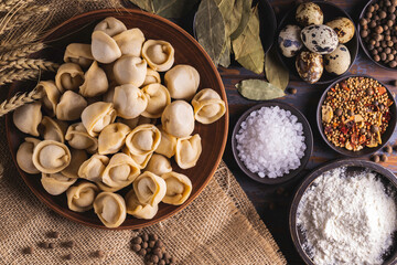 Raw homemade dumplings and ingredients. Meat dumplings - russian pelmeni. 