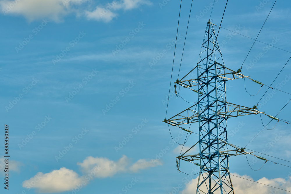 Wall mural a long line of electrical transmission towers carrying high voltage lines.