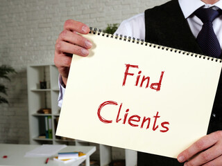 Business concept meaning Find Clients with inscription on the piece of paper.