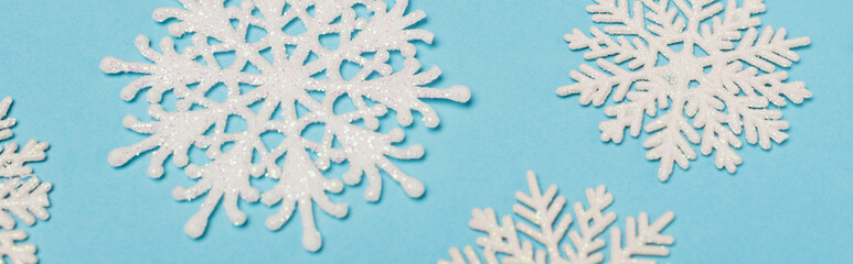 top view of winter snowflakes on blue background, 
