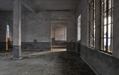 Fototapeta na wymiar Abandoned factory with light coming through the windows