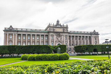 Obraz premium Neoclassical style of Sweden Parliament Building (Sveriges Riksdag) at Helgeandsholmen Island in the Gamla stan (Old Town) district of central Stockholm. Sweden.