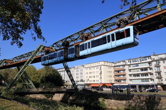WUPPERTAL, GERMANY - SEPTEMBER 19, 2020: Wuppertaler Schwebebahn (Wuppertal Suspension Railway) train in Germany. The unique electric monorail system is Wuppertal's landmark.