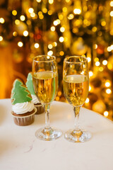 Champagne glasses and the lights on christmas tree