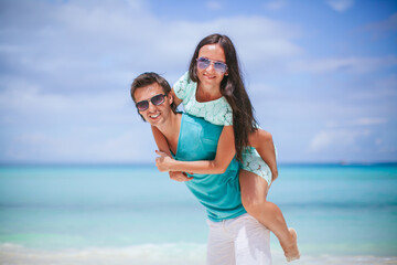 Young couple on white beach during summer vacation.