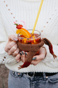 Winter cocktail in woman hands