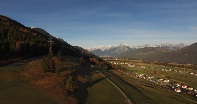 Innsbruck aerial view. Aerial Shots in the Alps. Spectacular panorama of city Innsbruck and Nordkette Mountain Range in Austria. 