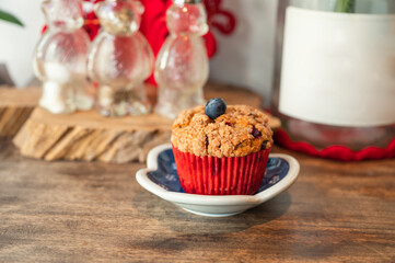 Homemade baked blueberry muffin on wooden table