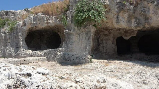 Graves in archaeological park of Syracuse (Siracusa); ruins of ancient city, Sicily, Italy. Footage 4k