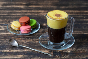 Traditional vietnamese egg coffee made of raw egg yolk and condensed milk, close up