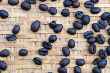 close up of coffee bean on tradition bamboo wicker background.