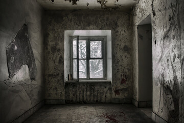 An old abandoned room with a window. Shabby walls. The tree outside the window.