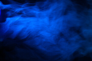 Fototapeta na wymiar blue smoke on a black background, fog on a dark background