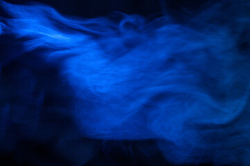 blue smoke on a black background, fog on a dark background
