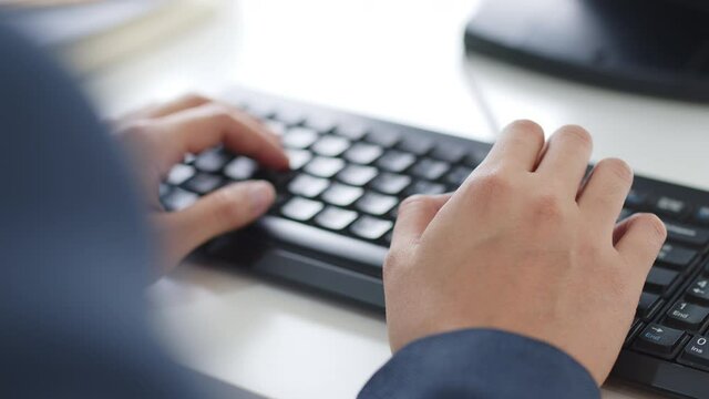Closeup business people hands typing on keyboard computer desktop for using internet, searching data, working, writing email.