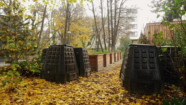 Side pan of composting bins in a ecological community