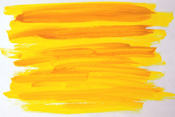 Yellow hand painted brush stroke daub on a white background. gouache.