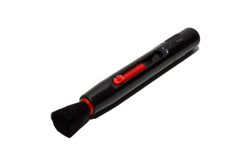 Brush for cleaning camera and laptop on a white background