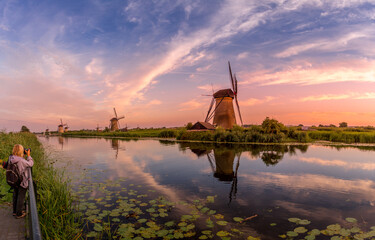 Windmills reflection at Kinderdijk UNESCO world heritage site, Netherlands, Europe during a...