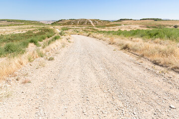 a gravel road in the mountains next to Fraga, province of Huesca, Aragon, Spain