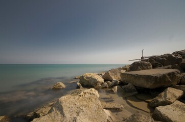 Seascape with cliff and old abandoned lighthouse