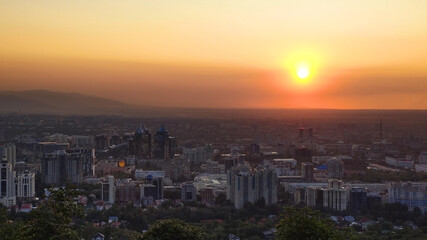 View from a height to the city of Almaty. Evening and sunset. Kazakhstan