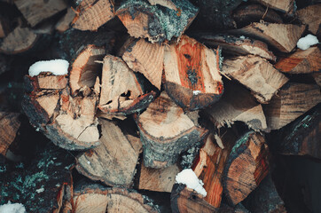 close up of firewood with snow