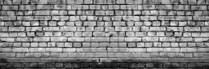 Grunge Grey White Brick Wall Background. Aged Wall Texture. Distressed Brickwork. Grungy Black Dark Stonewall Background.