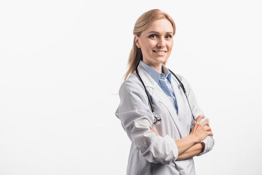  nurse in white coat standing with crossed arms isolated on white