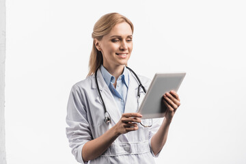  nurse in white coat using digital tablet isolated on white