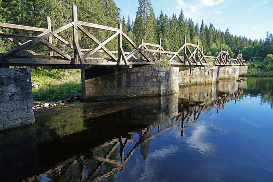 Historic canal bridge across river used for transport timber, Modrava, Sumava National Park, Czech Republic