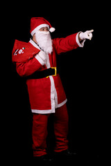 man with down syndrome dressed as santa claus on black background